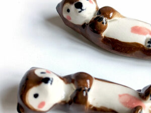 figurines couple otters