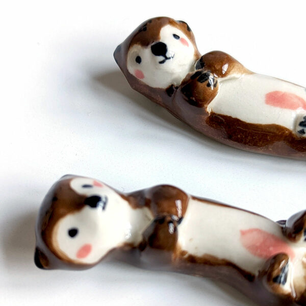 figurines couple otters