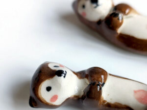 figurines couple otters