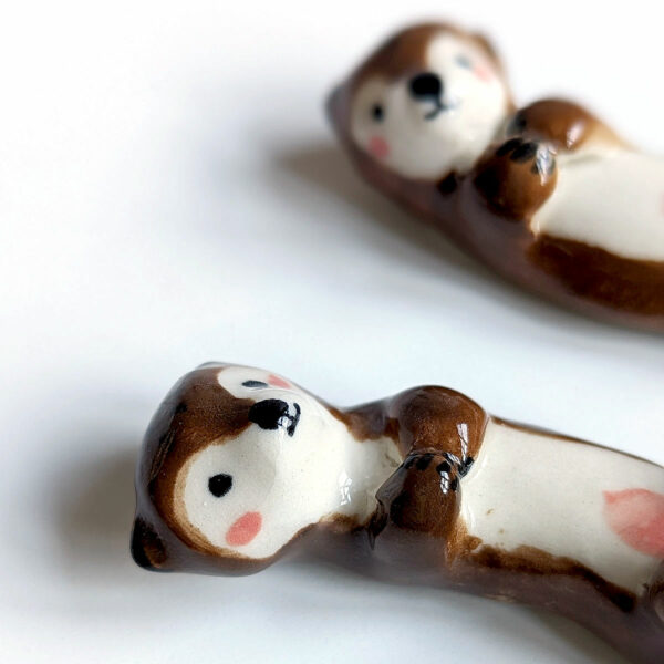 figurines couple otters