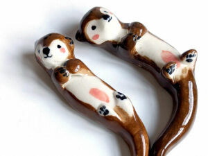 figurines couple otters