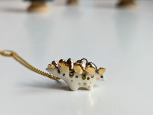 stegosaurus pendant cute porcelain jewelry by kness