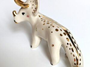 porcelain triceratops figurine with gold