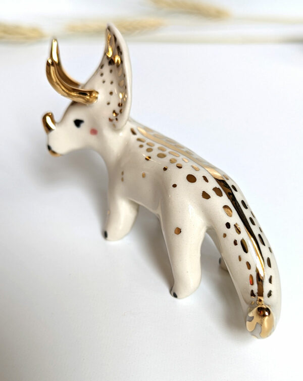 porcelain triceratops figurine with gold