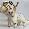 porcelain triceratops figurine with gold