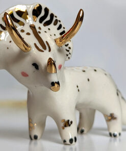 porcelain triceratops figurine with gold