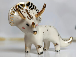 porcelain triceratops figurine with gold