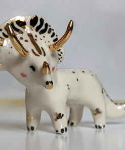 porcelain triceratops figurine with gold