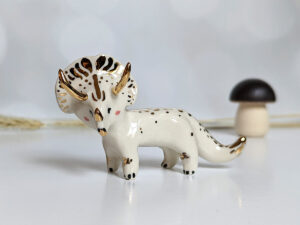 porcelain triceratops figurine with gold