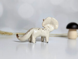 porcelain triceratops figurine with gold