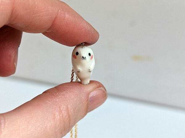 baby seal pendant in white porcelain