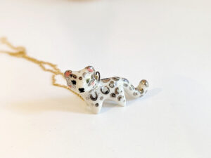 porcelain pendant snow leopard