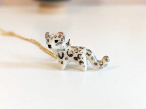 porcelain pendant snow leopard