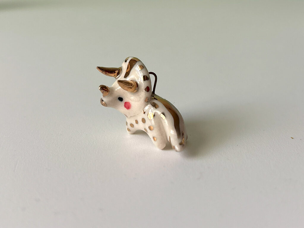 cute triceratops pendant in porcelain and gold