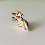 cute triceratops pendant in porcelain and gold