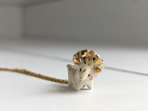 cute triceratops pendant porcelain and gold one of a kind precious gift
