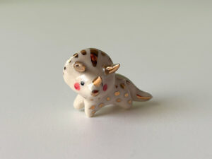 cute triceratops pendant in porcelain and gold