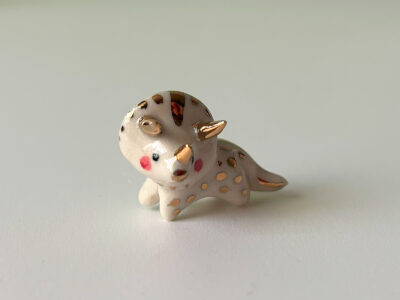 cute triceratops pendant in porcelain and gold