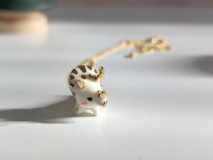 porcelain pendant cute triceratops kness dinosaur