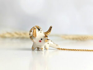 cute triceratops pendant handmade porcelain by kness