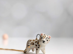 porcelain pendant snow leopard