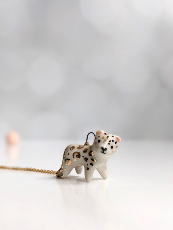 porcelain pendant snow leopard