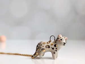 porcelain pendant snow leopard