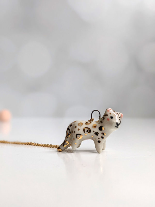 porcelain pendant snow leopard