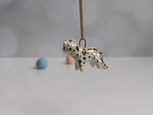porcelain pendant snow leopard