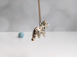 porcelain pendant snow leopard