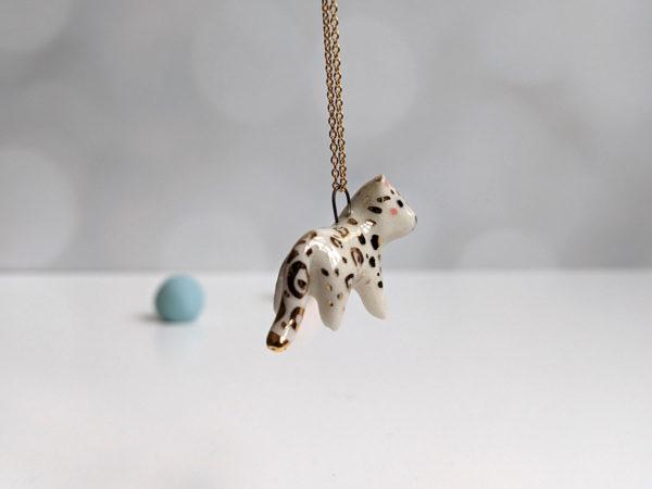 porcelain pendant snow leopard