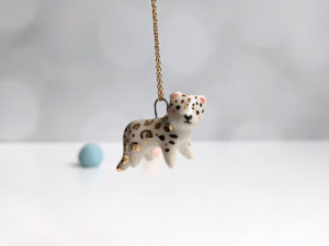 porcelain pendant snow leopard