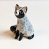 porcelain raccoon figurine cute