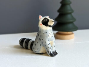 porcelain raccoon figurine cute