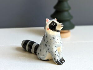 porcelain raccoon figurine cute