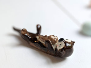 porcelain otter mom and baby figurine