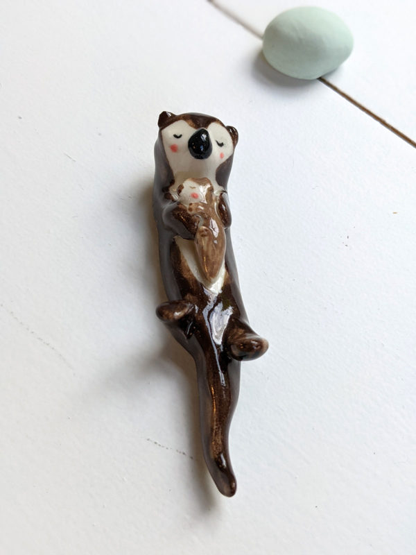 porcelain otter mom and baby figurine