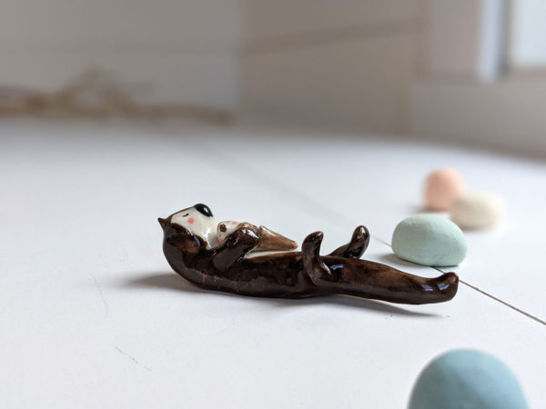 porcelain otter mom and baby figurine