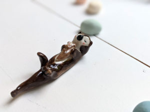 porcelain otter mom and baby figurine