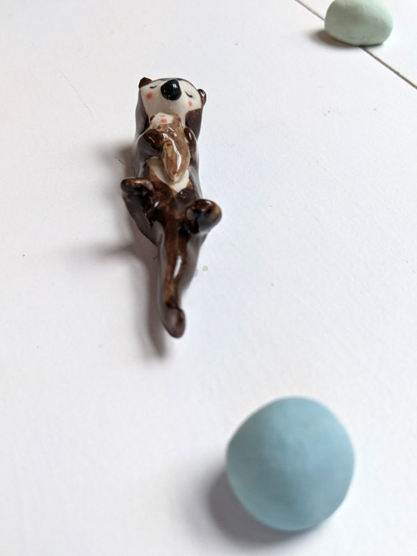 porcelain otter mom and baby figurine