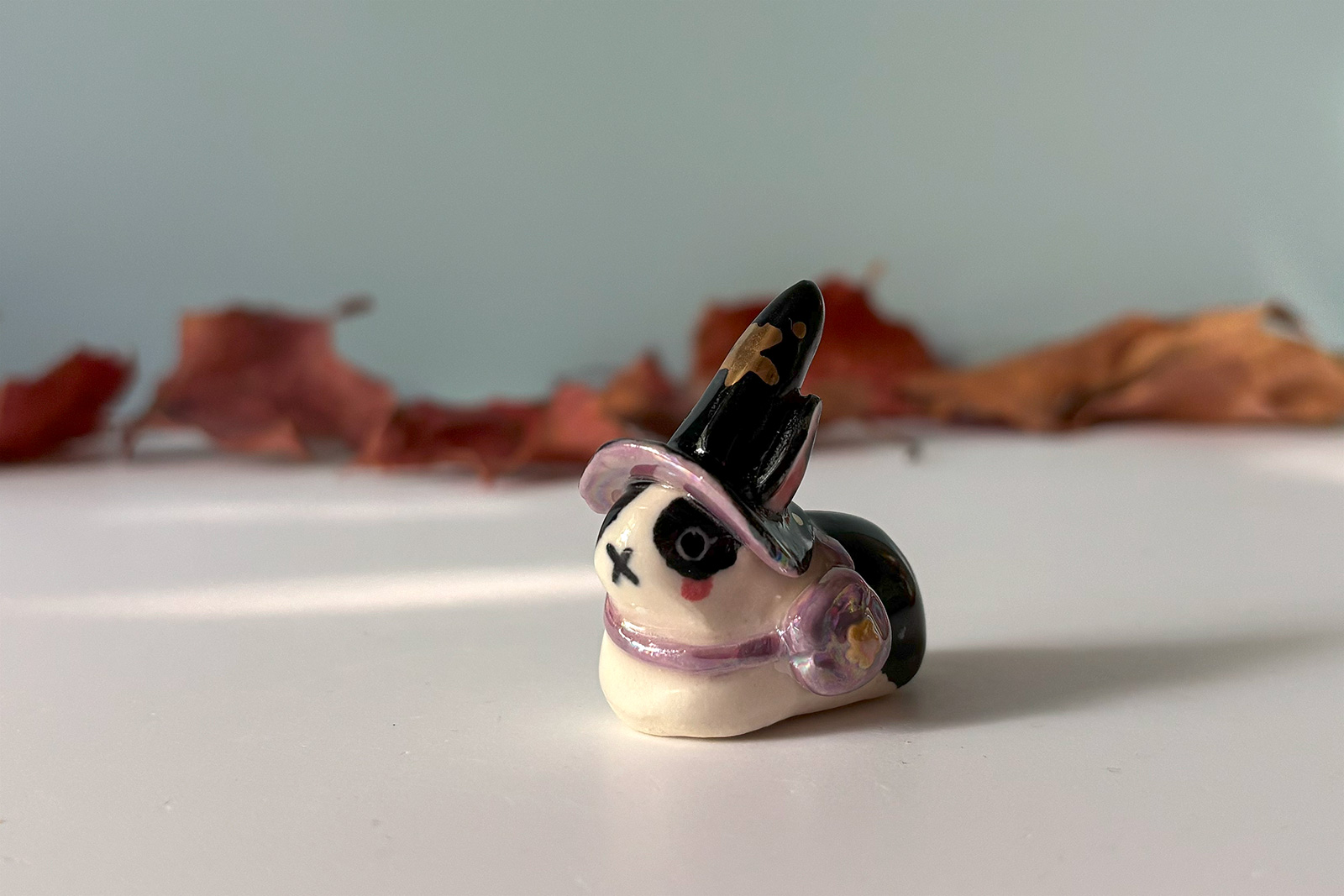 adorable porcelain figurine of a witch bunny