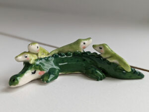 cute porcelain crocodile mama figurine and babies