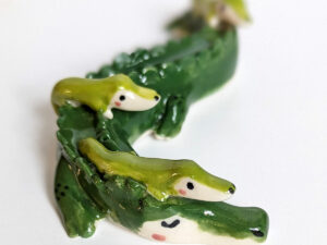 cute porcelain crocodile mama figurine and babies