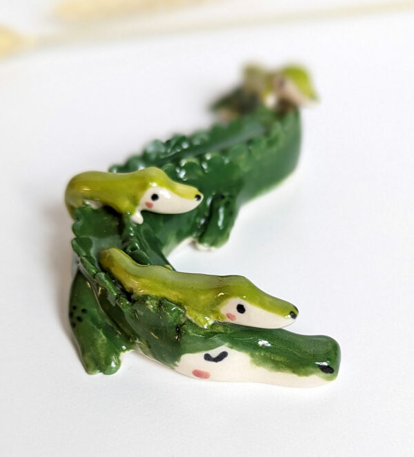 cute porcelain crocodile mama figurine and babies