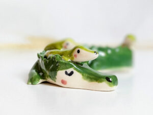 cute porcelain crocodile mama figurine and babies