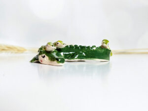 cute porcelain crocodile mama figurine and babies