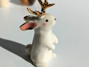 jackalope figurine with golden antlers