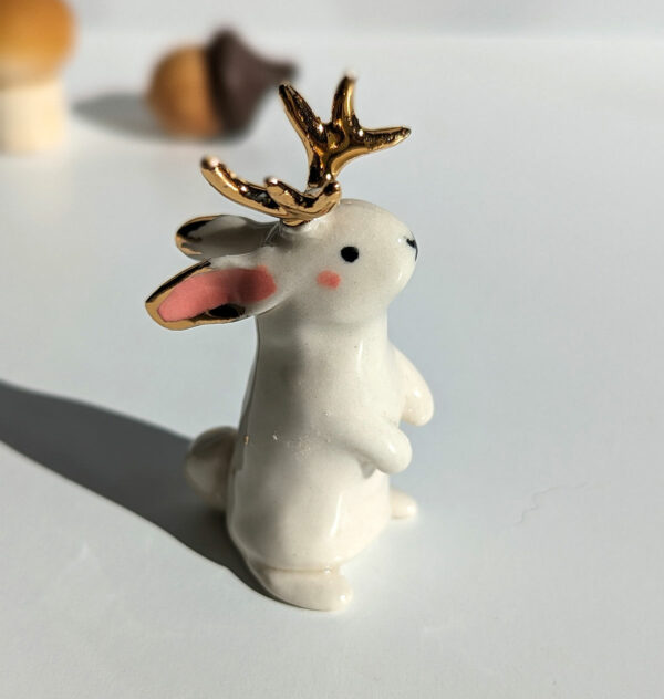 jackalope figurine with golden antlers