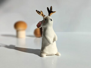 jackalope figurine with golden antlers