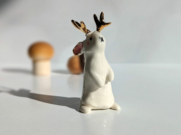 jackalope figurine with golden antlers